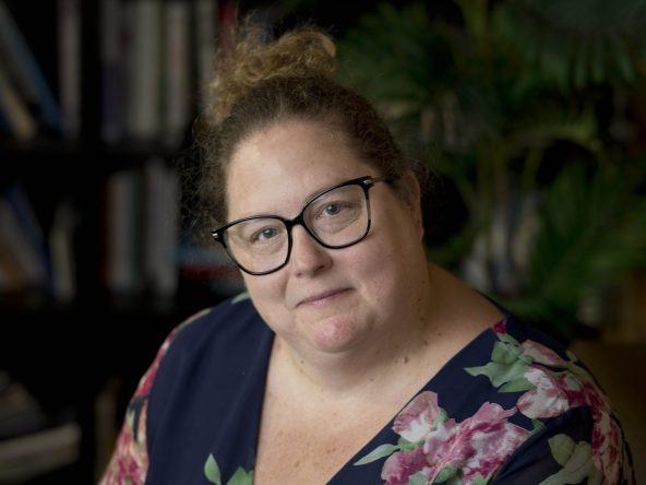 Claire Crampton neurodivergent therapist, looking at the camera wearing a floral top